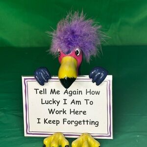 Colorful Bird Figurine with Sign